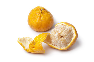 Whole and peeled Ugli fruit