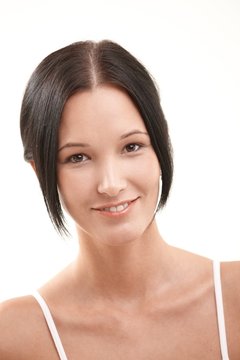 Natural looking young woman smiling