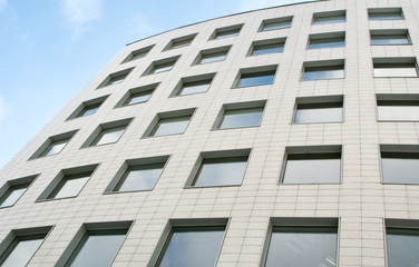 facade of modern building house over blue sky