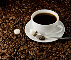 cup of coffee on beans