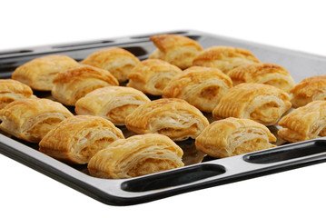 Black baking pan with fresh baked bourekas