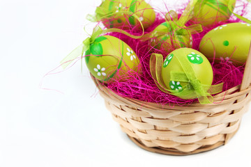 Wood bascket with green Easter eggs