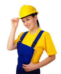 Young beautiful woman in construction uniform