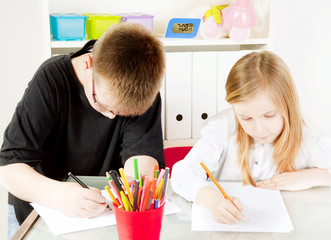 children in kindergarten painting drawings