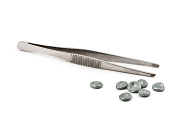 Tweezers and zinc pieces