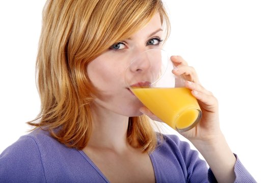 young beautiful woman with orangejuice (white background)