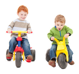 Children riding kids tricycles