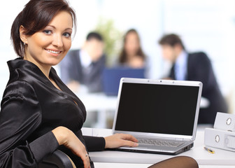 business woman with team working on laptop