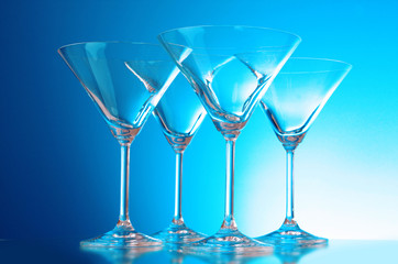 empty glasses of martini on the light blue background
