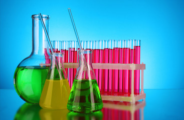 Laboratory glassware on blue background