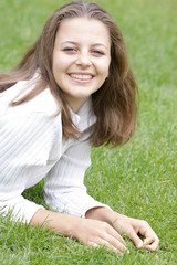 young happy woman resting on natural background