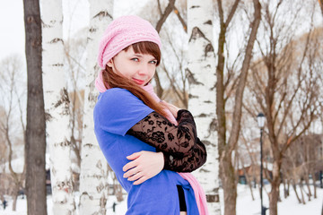 woman is in winter in a park