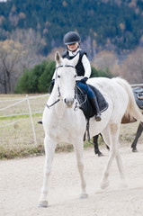 Horse riding - little girl is riding a horse