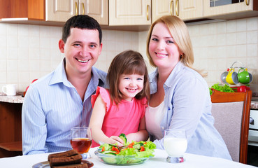 Dad, Mom and their little daughter