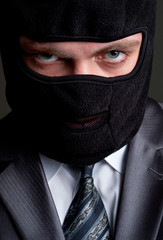 Businessman in black balaclava