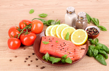 Red fish, lemon, pepper and tomato