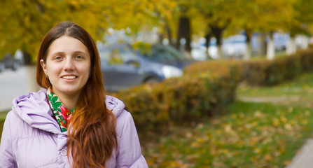 girl  on city street in autumn