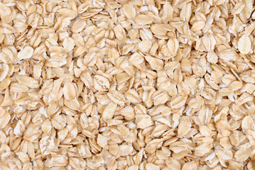 Oatmeal flakes close up as background