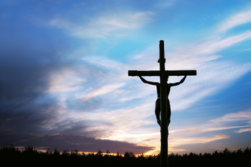 Cross silhouette and the clouds
