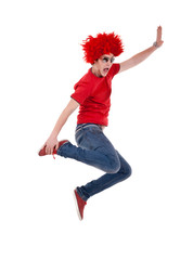 funky man with red big wig jumps