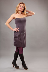 Fototapeta premium Blond lady on gray background