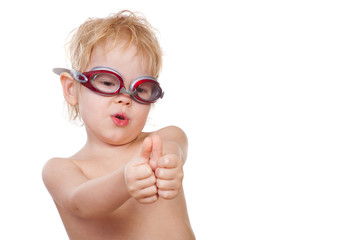 child in swimming goggles
