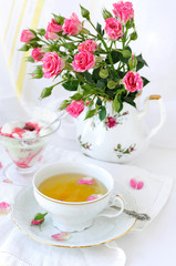 Rose bouquet and cup of tea