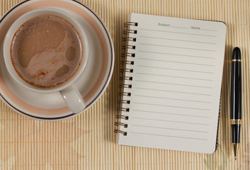 Obraz na płótnie Canvas notebook and coffee