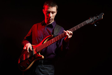 Obraz premium Portrait of musician with bass guitar