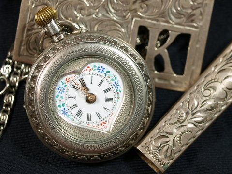 Antique silver watches with painted porcelain face