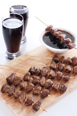 Grilled chicken hearts on skewers