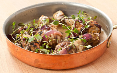 Chicken with thymes in pan