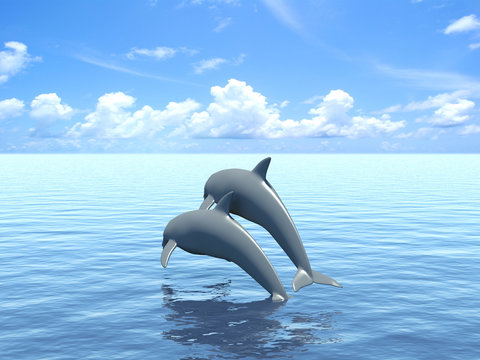 Two dolphins floating in ocean.