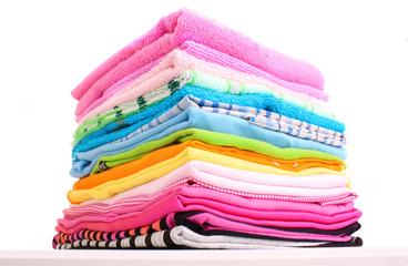 Pile of colorful clothes over white background