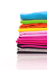 Pile of colorful clothes over white background
