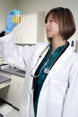 Woman Doctor with Urine Sample