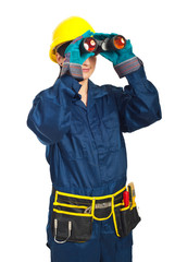 Builder woman looking through binocular