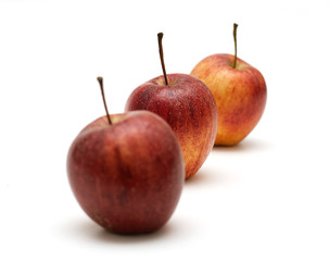 focused apple in a line of three apples