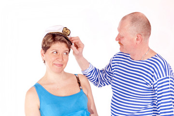 Middle aged couple posing as sailors