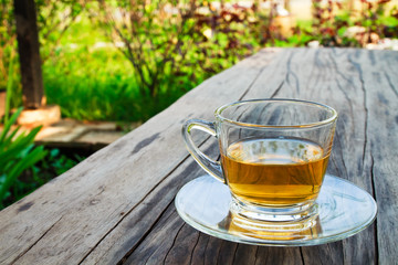 A cup of tea on the table in the garden