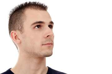 Obraz premium Portrait of a handsome young man looking upwards