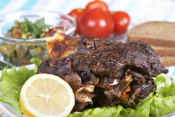 Roast leg of lamb on decorated table
