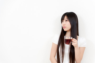 beautiful asian woman with a cup of tea