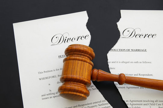torn divorce decree and legal gavel (gavel is sharp)