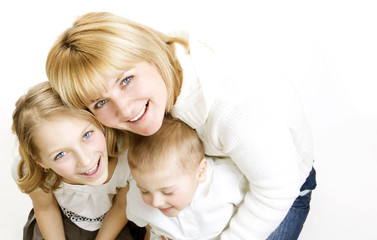 Fototapeta na wymiar Mother with kids.Happy Smiling Family over white