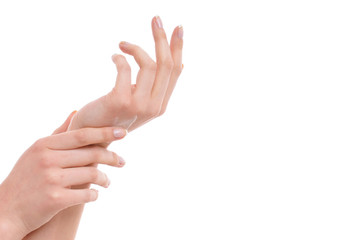 pair of female hands with hand care cream
