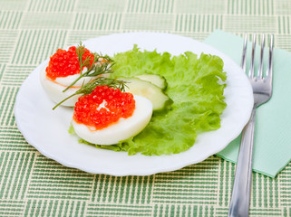 Salad of vegetables with red caviar