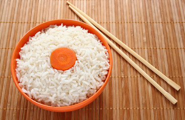 Rice and a slice of carrot as a flag of Japan.
