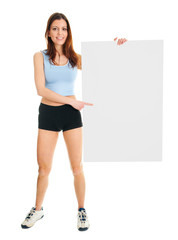 Fitness woman presenting empty placard