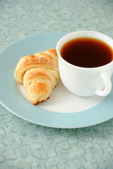 Croissant and a cup of tea